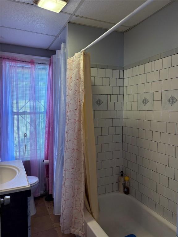 282 Oxford St, Providence, RI 02905 - full bathroom featuring shower / bathtub combination with curtain, tile patterned floors, and vanity