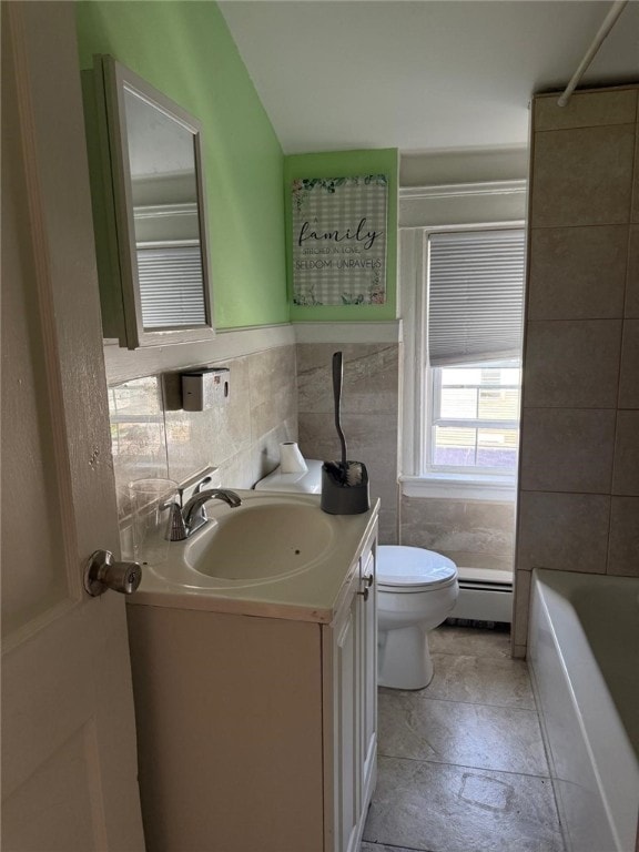 282 Oxford St, Providence, RI 02905 - bathroom with a baseboard radiator, vanity, and a tub