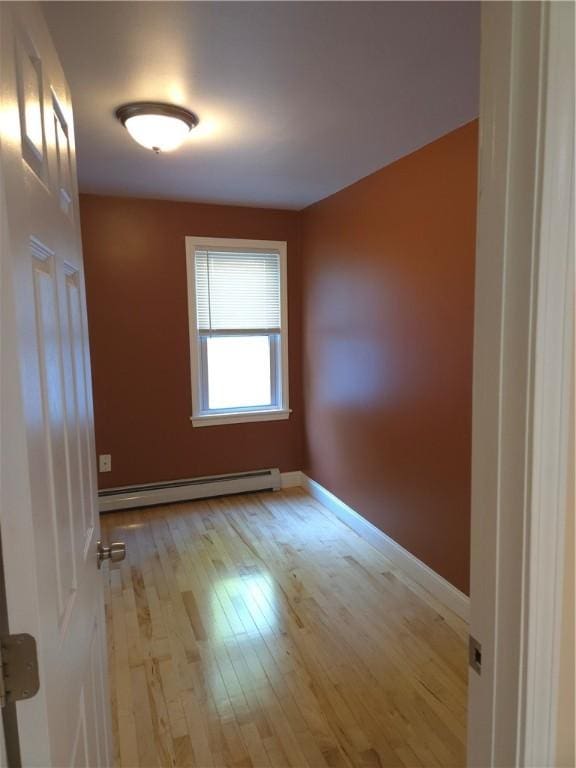 7 Edge St, West Warwick, RI 02893 - spare room featuring a baseboard radiator and wood-type flooring