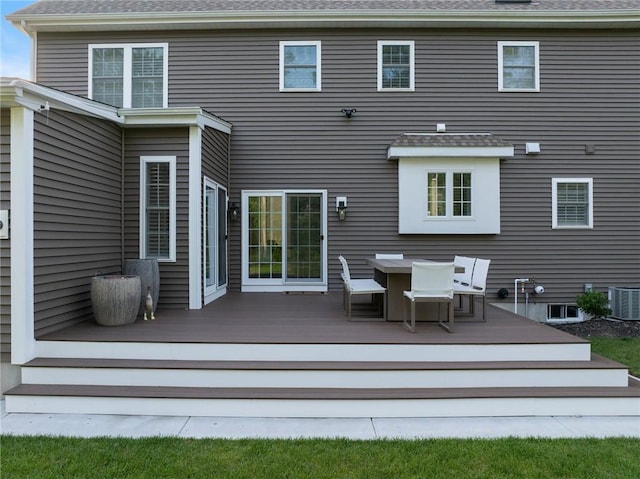 3 Kelsey Eden Way, Cumberland, RI 02864 - back of property featuring a wooden deck, outdoor dining space, and roof with shingles