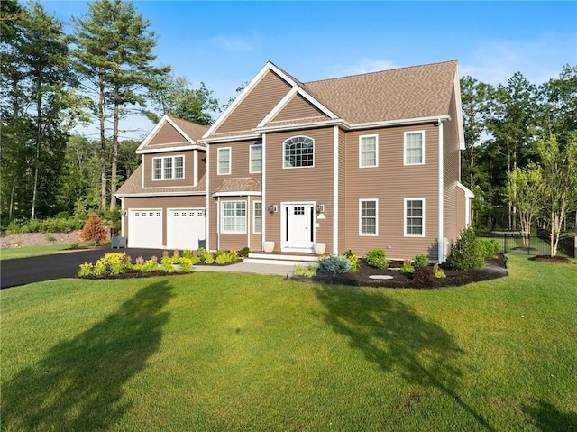 3 Kelsey Eden Way, Cumberland, RI 02864 - view of front of home featuring asphalt driveway, a front yard, an attached garage, and roof with shingles