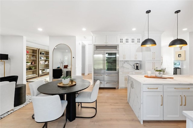 3 Kelsey Eden Way, Cumberland, RI 02864 - kitchen featuring stainless steel built in refrigerator, white cabinets, recessed lighting, light wood-style flooring, and decorative light fixtures