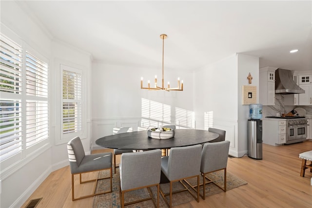 3 Kelsey Eden Way, Cumberland, RI 02864 - dining room featuring plenty of natural light, a chandelier, light wood-type flooring, recessed lighting, and wainscoting
