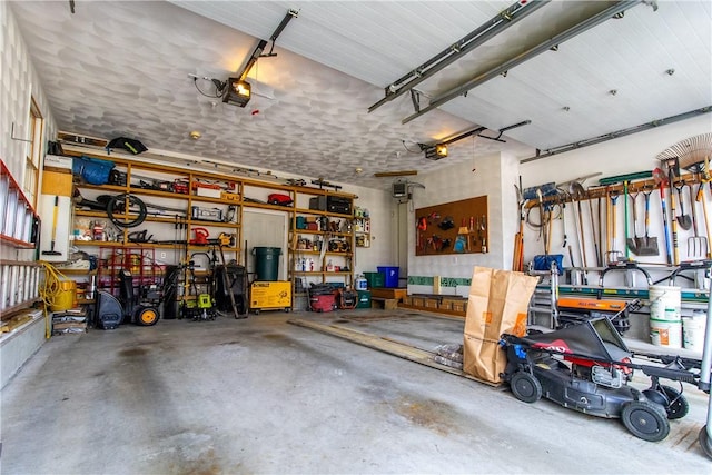 136 Woodward Rd, Providence, RI 02904 - garage with a garage door opener and a workshop area
