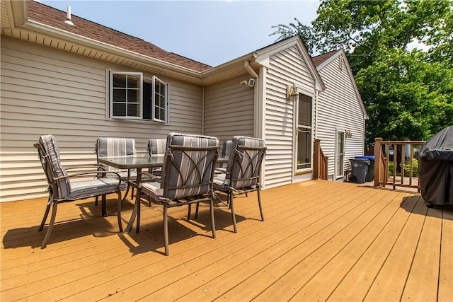 136 Woodward Rd, Providence, RI 02904 - wooden terrace with outdoor dining space and a grill