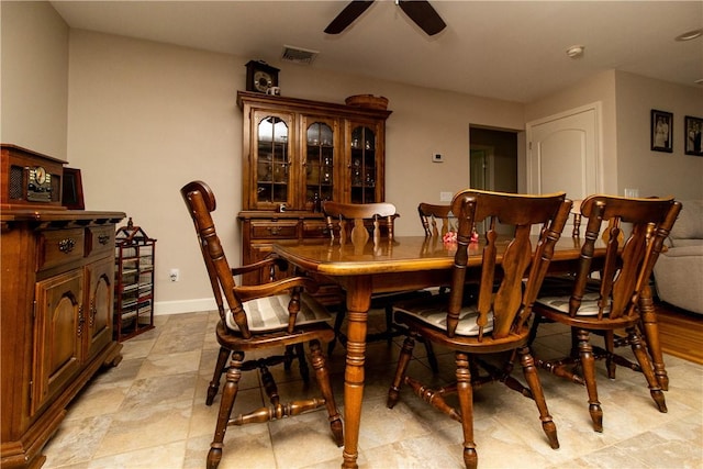 136 Woodward Rd, Providence, RI 02904 - dining room featuring a ceiling fan and baseboards
