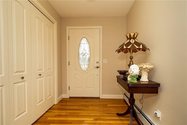 136 Woodward Rd, Providence, RI 02904 - foyer featuring wood finished floors and a baseboard heating unit