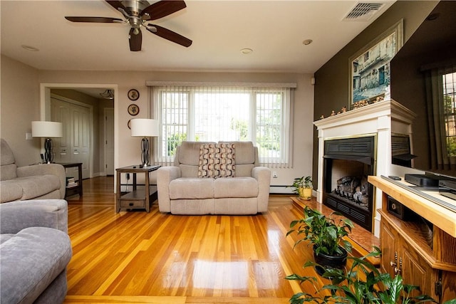 136 Woodward Rd, Providence, RI 02904 - living room with plenty of natural light, light wood-style floors, and ceiling fan