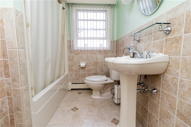 136 Woodward Rd, Providence, RI 02904 - bathroom featuring baseboard heating, shower / bath combo with shower curtain, tile walls, and tile patterned flooring