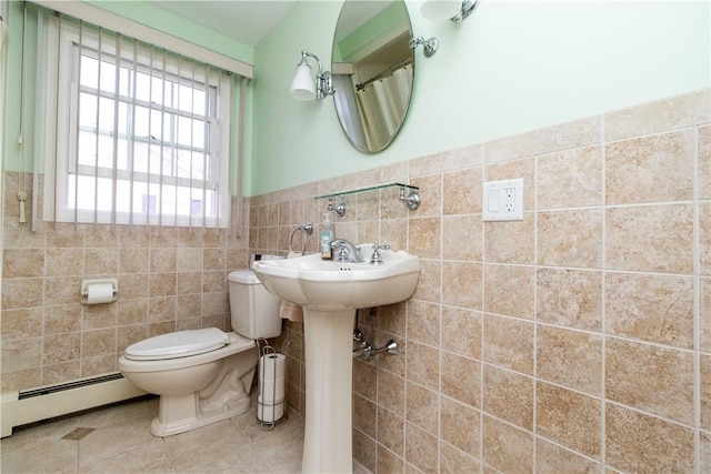 136 Woodward Rd, Providence, RI 02904 - full bath with tile walls, baseboard heating, wainscoting, and tile patterned flooring