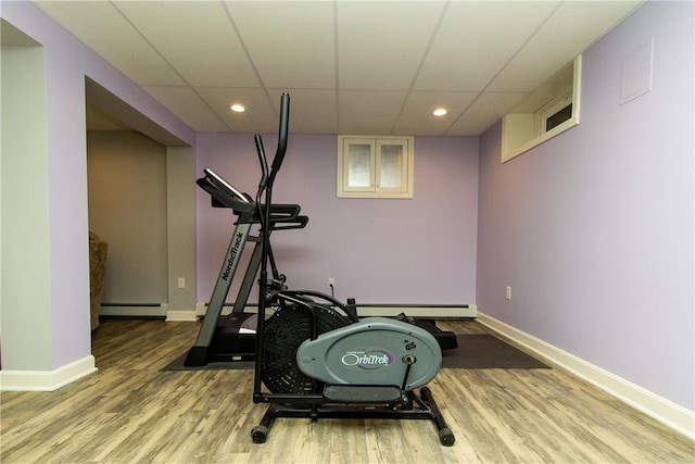 136 Woodward Rd, Providence, RI 02904 - workout room with a baseboard radiator, a baseboard heating unit, recessed lighting, wood finished floors, and a paneled ceiling
