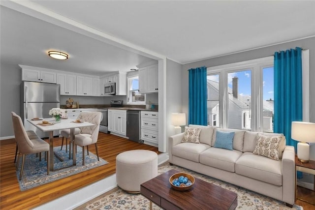 22 Hillcrest Dr, West Warwick, RI 02893 - living area featuring wood finished floors and baseboards