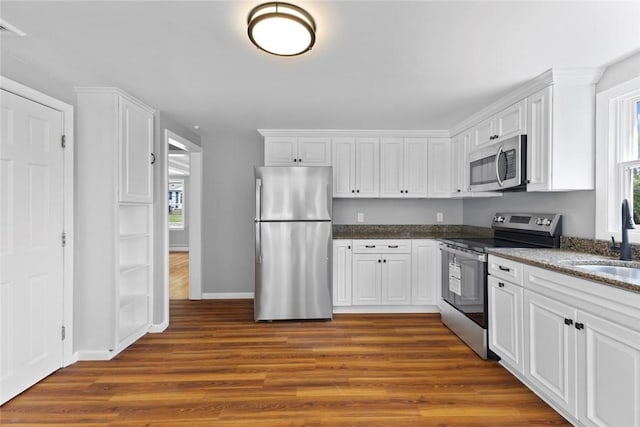 22 Hillcrest Dr, West Warwick, RI 02893 - kitchen with appliances with stainless steel finishes, dark wood-style floors, and healthy amount of natural light