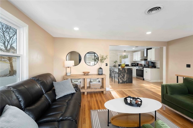 6 Flanders St, Johnston, RI 02919 - living room with light wood-type flooring and recessed lighting