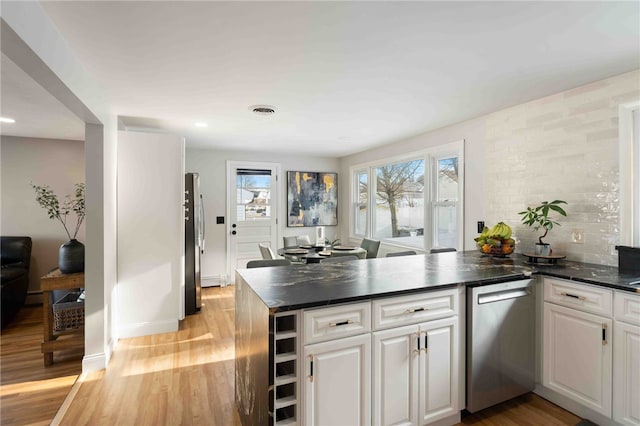 6 Flanders St, Johnston, RI 02919 - kitchen featuring appliances with stainless steel finishes, a peninsula, dark countertops, white cabinetry, and recessed lighting