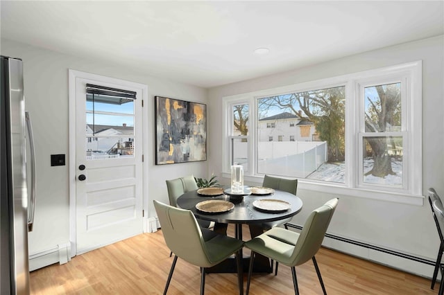 6 Flanders St, Johnston, RI 02919 - dining area with a baseboard heating unit and light wood-style flooring
