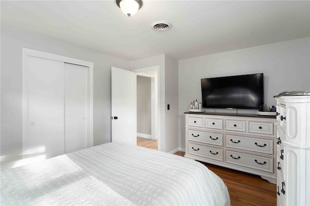 6 Flanders St, Johnston, RI 02919 - bedroom featuring dark wood-type flooring and a closet
