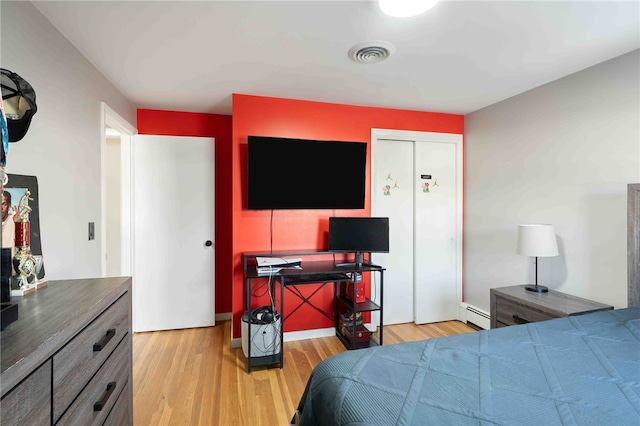 6 Flanders St, Johnston, RI 02919 - bedroom featuring a baseboard radiator and light wood-style floors