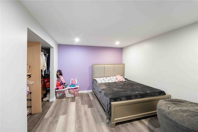 6 Flanders St, Johnston, RI 02919 - bedroom with light wood-style floors, a walk in closet, and recessed lighting