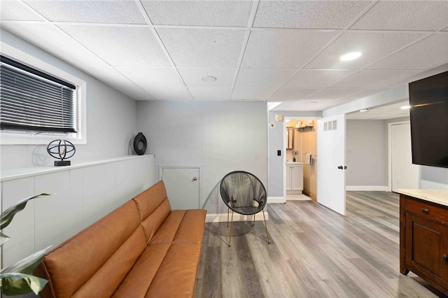 6 Flanders St, Johnston, RI 02919 - sitting room with a paneled ceiling and light wood-type flooring