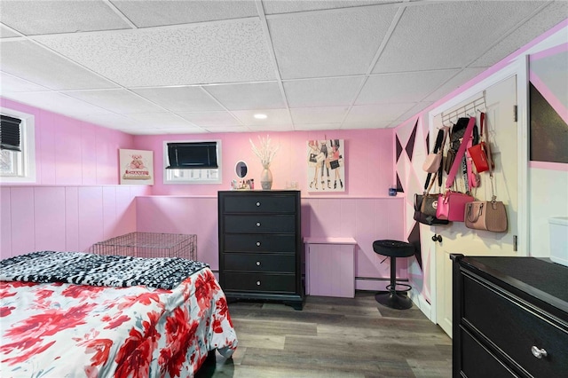 6 Flanders St, Johnston, RI 02919 - bedroom with a drop ceiling, wood finished floors, a baseboard radiator, and a wall unit AC