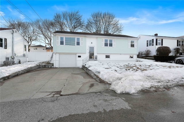 6 Flanders St, Johnston, RI 02919 - raised ranch featuring an attached garage and driveway