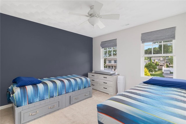 29 Gilcrest Dr, West Warwick, RI 02893 - bedroom with light colored carpet and a ceiling fan