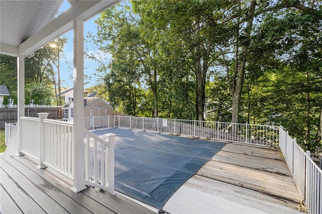29 Gilcrest Dr, West Warwick, RI 02893 - wooden deck featuring a storage unit and view of wooded area