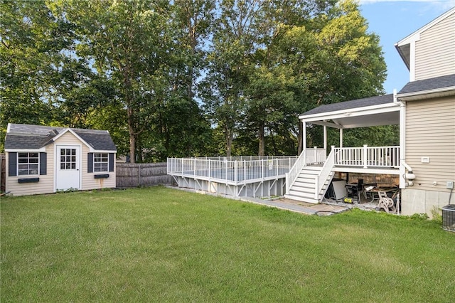 29 Gilcrest Dr, West Warwick, RI 02893 - fenced backyard with an outbuilding, a pool, and stairs