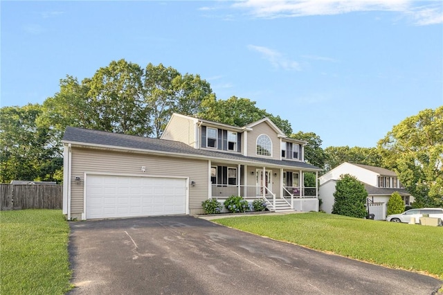 29 Gilcrest Dr, West Warwick, RI 02893 - view of front of house with a porch, driveway, and an attached garage