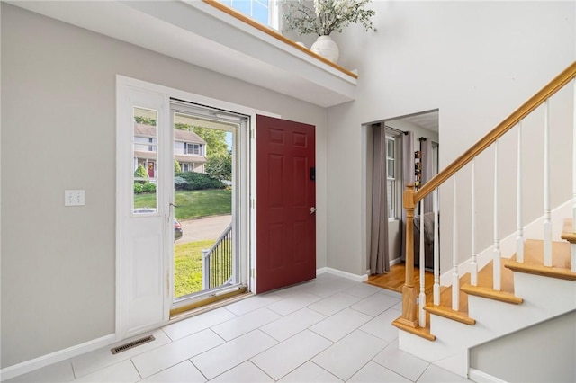 29 Gilcrest Dr, West Warwick, RI 02893 - foyer with stairway, light tile patterned flooring, and a towering ceiling