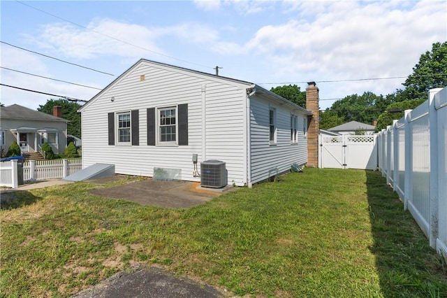 59 Waite St, Providence, RI 02908 - view of side of property featuring a gate and a fenced backyard