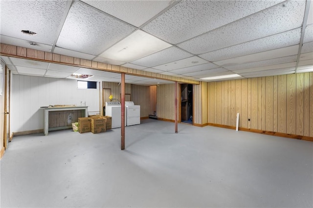 59 Waite St, Providence, RI 02908 - basement featuring a paneled ceiling, washer and clothes dryer, and wood walls