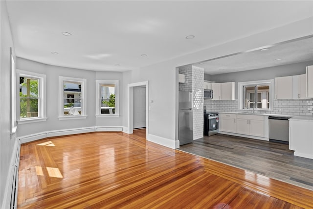 33 Marion Ave, Providence, RI 02905 - unfurnished living room featuring dark wood-style floors, baseboard heating, and recessed lighting