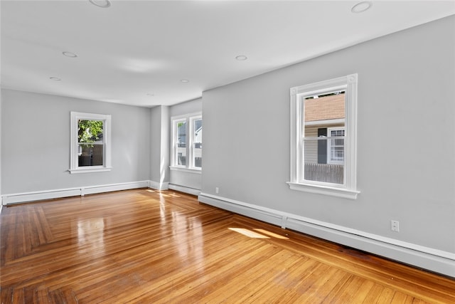 33 Marion Ave, Providence, RI 02905 - empty room featuring baseboard heating, wood finished floors, and recessed lighting