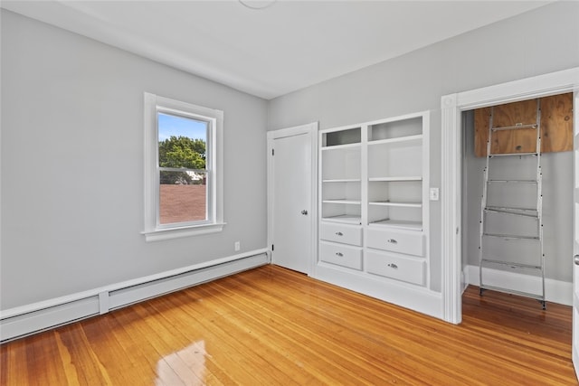 33 Marion Ave, Providence, RI 02905 - unfurnished bedroom featuring baseboard heating and light wood-style floors