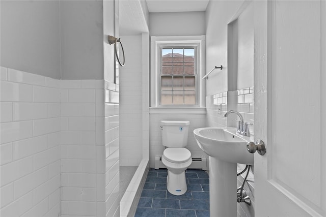 33 Marion Ave, Providence, RI 02905 - full bath with a baseboard radiator, tile walls, tile patterned flooring, wainscoting, and a shower