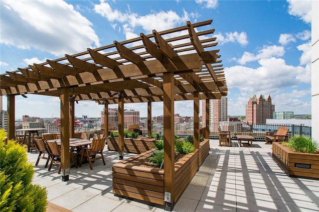 100 Exchange St Unit 1803, Providence, RI 02903 - wooden terrace featuring a pergola, a city view, a patio, and outdoor dining space