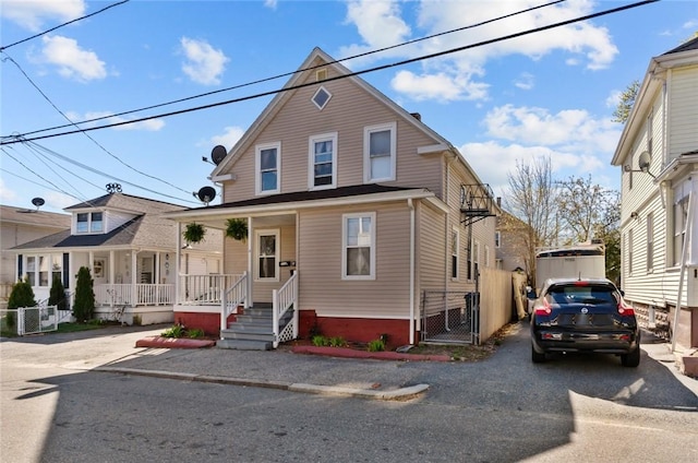 18 Ortoleva Dr, Providence, RI 02909 - view of front of property featuring covered porch, a gate, and driveway