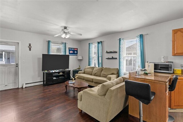 18 Ortoleva Dr, Providence, RI 02909 - living area featuring a baseboard heating unit, ceiling fan, and dark wood-style floors