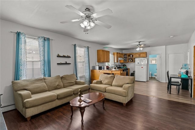 18 Ortoleva Dr, Providence, RI 02909 - living room with a baseboard radiator, healthy amount of natural light, a ceiling fan, and wood finished floors