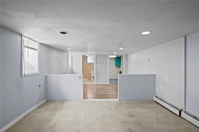 18 Ortoleva Dr, Providence, RI 02909 - below grade area featuring carpet, a baseboard heating unit, and recessed lighting
