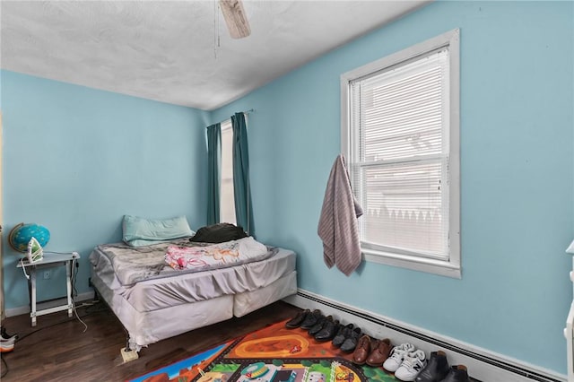 18 Ortoleva Dr, Providence, RI 02909 - bedroom featuring a baseboard radiator, wood finished floors, and ceiling fan
