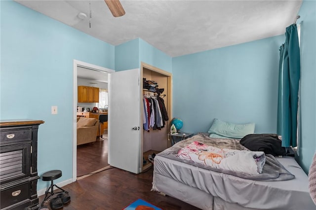 18 Ortoleva Dr, Providence, RI 02909 - bedroom with dark wood finished floors, ceiling fan, and a closet