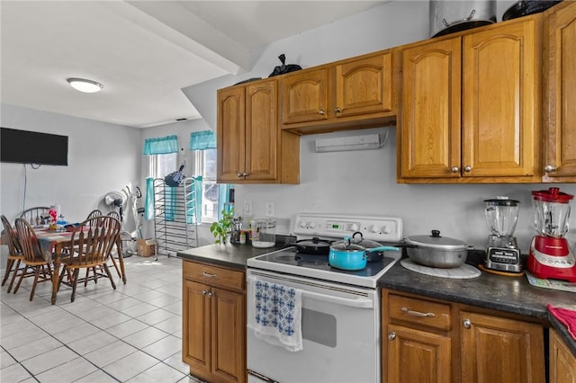 18 Ortoleva Dr, Providence, RI 02909 - kitchen featuring white electric range oven, brown cabinetry, light tile patterned floors, and dark countertops