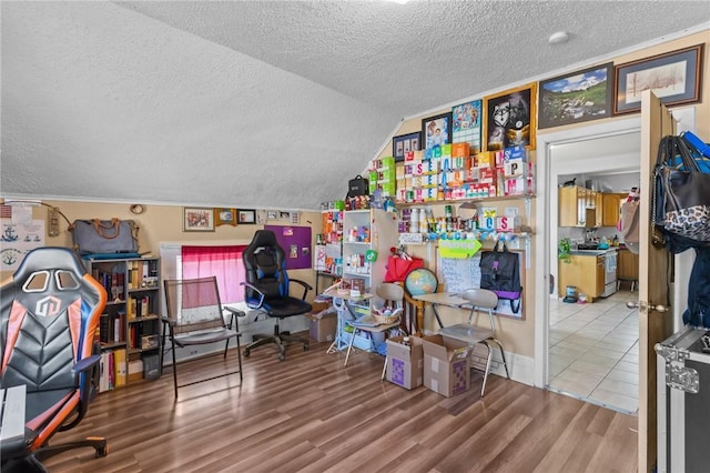 18 Ortoleva Dr, Providence, RI 02909 - office space with a textured ceiling, wood finished floors, and vaulted ceiling