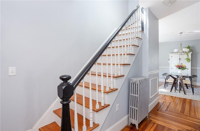 6 Pond Ave, Newport, RI 02840 - stairs featuring radiator, wood finished floors, and a chandelier