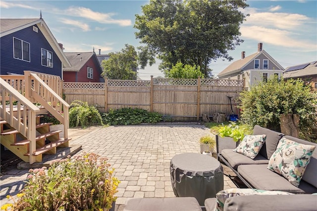 6 Pond Ave, Newport, RI 02840 - fenced backyard with a patio and an outdoor hangout area