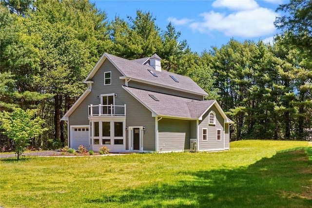 888 Plainfield Pike, Coventry, RI 02827 - back of house featuring a balcony, a yard, a shingled roof, and a garage