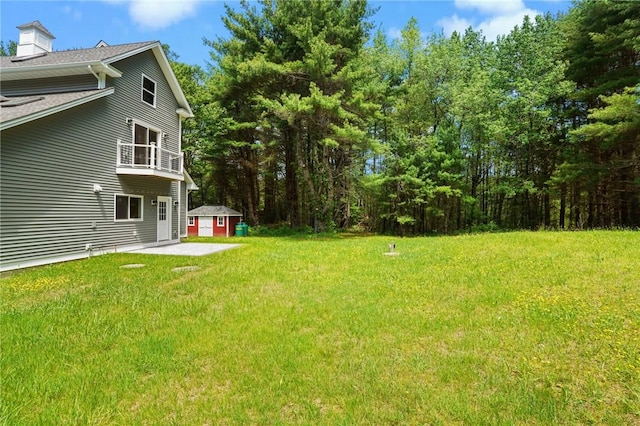 888 Plainfield Pike, Coventry, RI 02827 - view of green lawn with a balcony and a storage unit